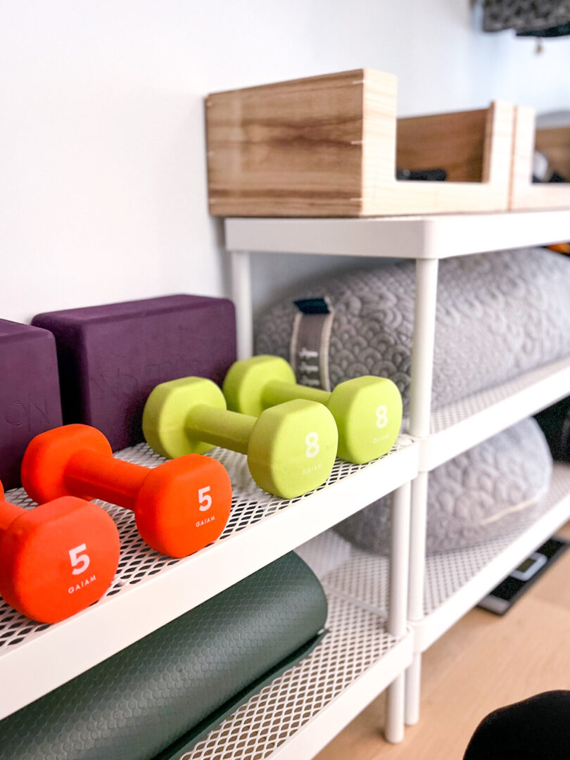 A rack with different types of exercise equipment.