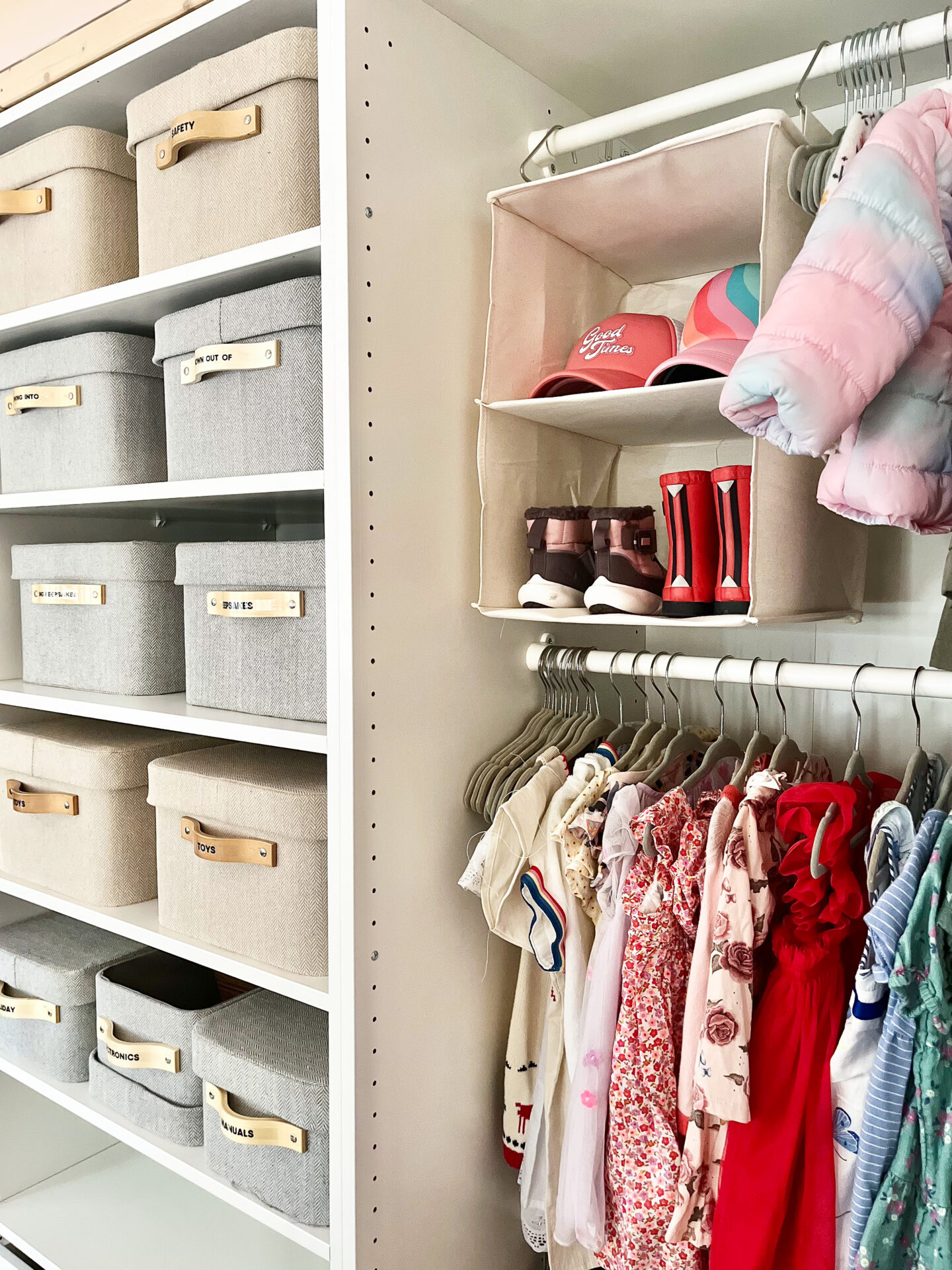 A closet with shelves and baskets of clothes